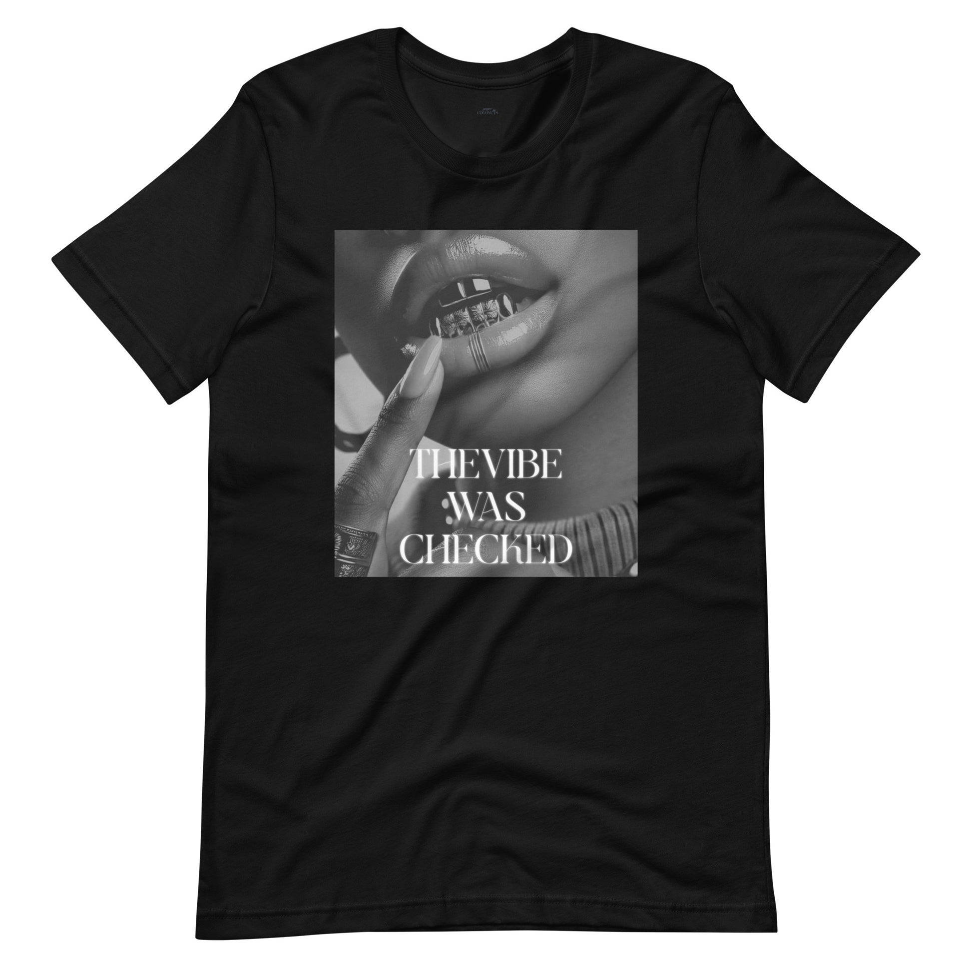 Black graphic t-shirt featuring a bold black-and-white print of lips with a grill and the phrase "THE VIBE WAS CHECKED.
