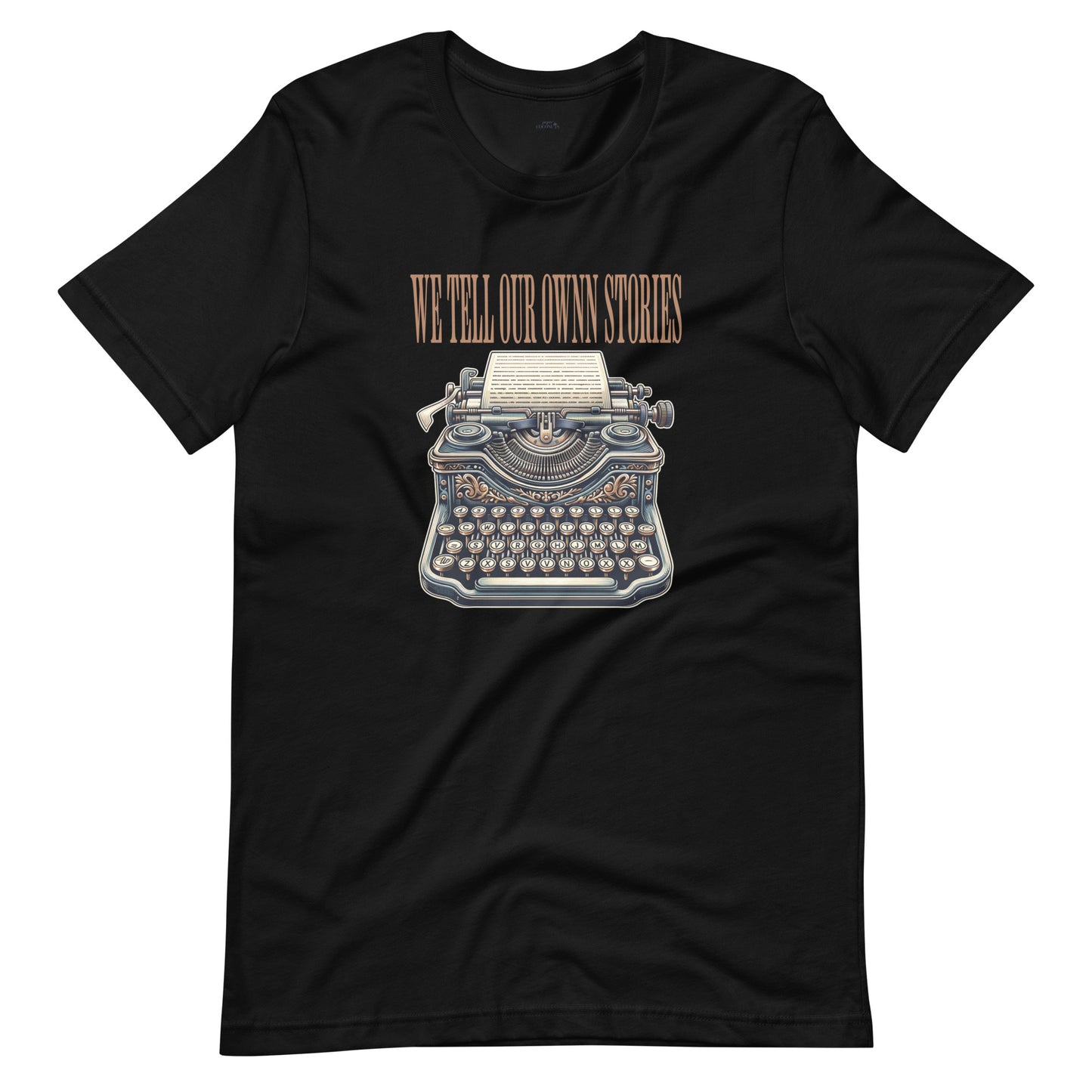 Black t-shirt featuring a vintage typewriter graphic and the phrase "WE TELL OUR OWN STORIES" in bold lettering.