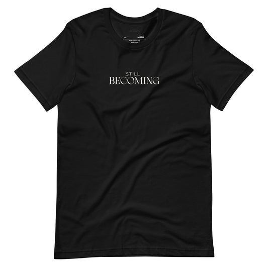Black unisex graphic t-shirt with Still Becoming text design by Paper Coconuts, minimalist style for everyday comfort