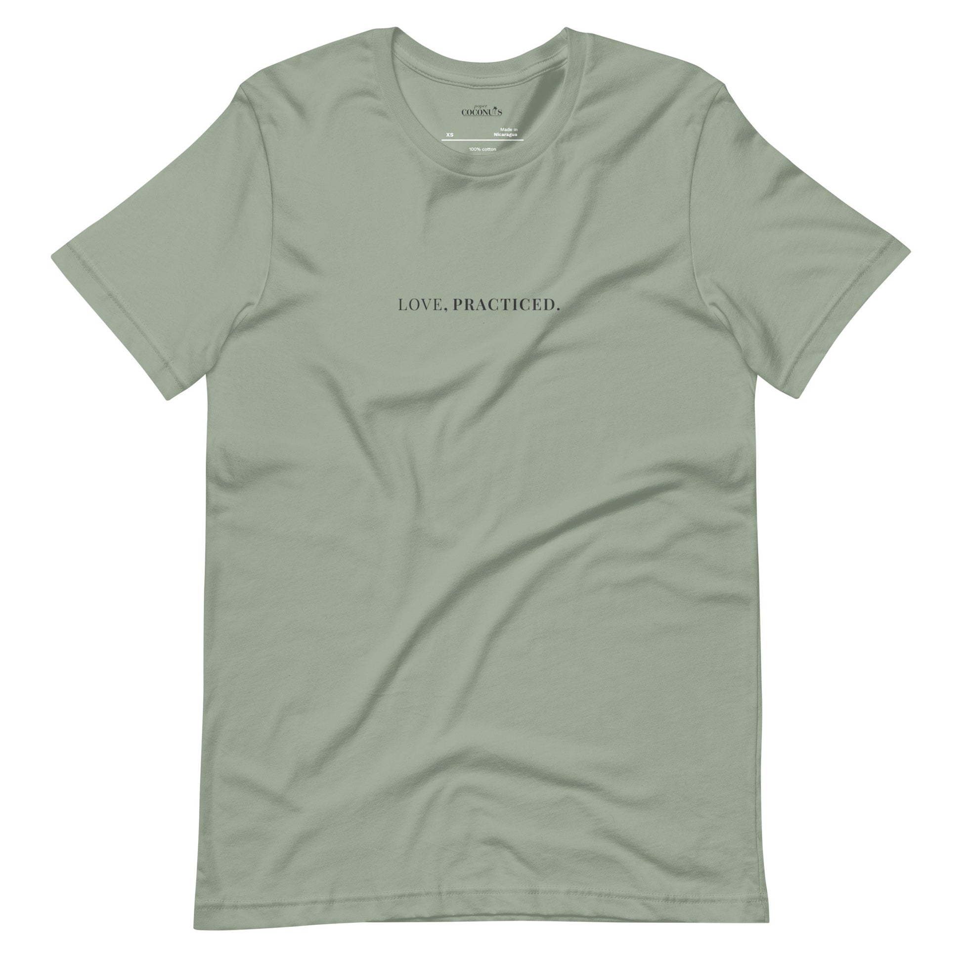 Sage minimal graphic t-shirt with Love Practiced text by Paper Coconuts, soft cotton tee for everyday wear and self-expression