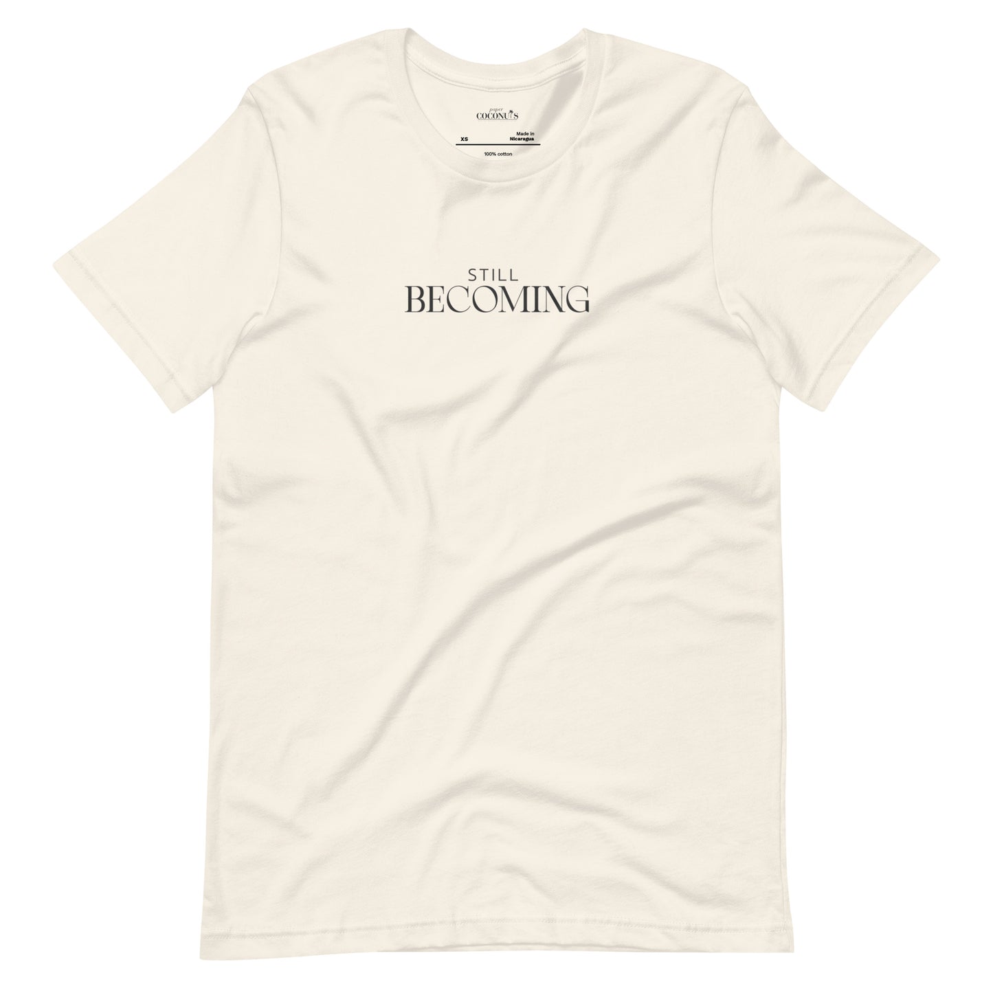 Vintage white unisex graphic t-shirt with Still Becoming text design by Paper Coconuts, minimalist style for everyday comfort